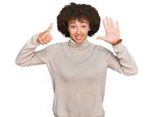Young hispanic girl wearing wool winter sweater showing and pointing up with fingers number six while smiling confident and happy.