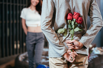 Asian man hiding roses to surprise his girlfriend on dating in Valentine's, Anniversary or...