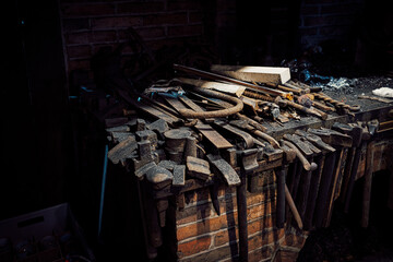 rusty metal tools on smith workbench
