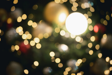 Blurred background of Christmas Tree with Decoration christmas lights. Bokeh garlands in the...