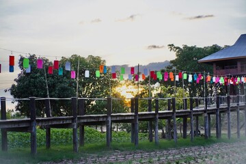 wooden bridge and lanterns , Lanterns hang to decorate the bridge in front of the garden in Yangna...