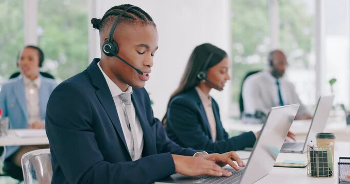Call center, black man talking and typing on laptop, telemarketing and contact us for support at crm help desk. Happy customer service consultant on computer, sales agent and business professional.