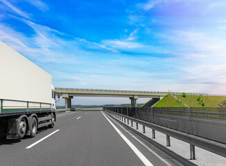 White truck on the highway. White truck on asphalt road.