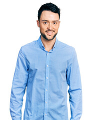 Hispanic man with beard wearing casual business shirt with a happy and cool smile on face. lucky...
