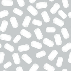 White textured rectangular ice flakes or marshmallows on a light gray background form a winter seamless pattern for textile, holiday wrapping paper. Vector.
