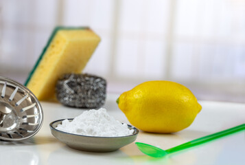 Baking soda, vinegar and cut lemons Materiel for non toic cleaning