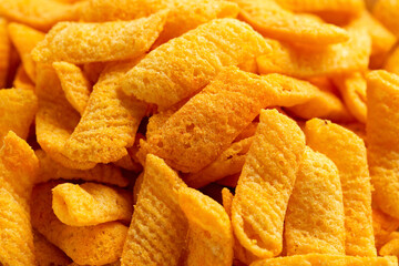 Crunchy Nacho cheese corn snack in white bowl