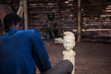 African wood carver at work