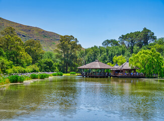 Fototapeta na wymiar Postcard Cafe in the middle of the lake at Stark-Conde Wines, Cape Town, South Africa