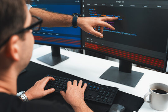 IT developers creating online software development information on screen laptop with coding program in data of application and website. Technical engineer coder on safety program concept. Sellable.
