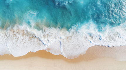 Fototapeta na wymiar A drone view of the seaside. Blue waves and yellow sand