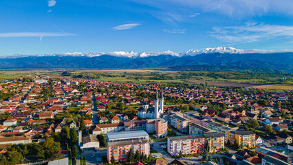 Little town near Fagaras mountains in Romania | drone view - obrazy, fototapety, plakaty
