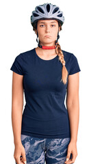 Beautiful caucasian woman wearing bike helmet depressed and worry for distress, crying angry and afraid. sad expression.