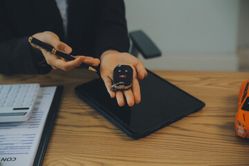 Salesman send key to customer after good deal agreement, successful car loan contract buying or selling new vehicle.