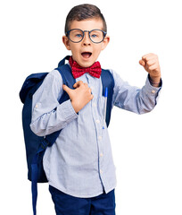 Cute blond kid wearing nerd bow tie and backpack screaming proud, celebrating victory and success...