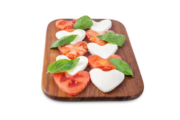 Caprese salad with tomatoes and mozzarella in the shape of hearts for Valentine's Day on a white isolated background