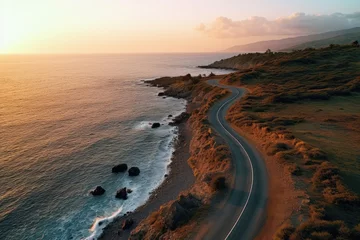 Papier Peint photo Atlantic Ocean Road Aerial view of a road leading to the ocean at sunset, Aerial view of a road along the sea at sunset, AI Generated