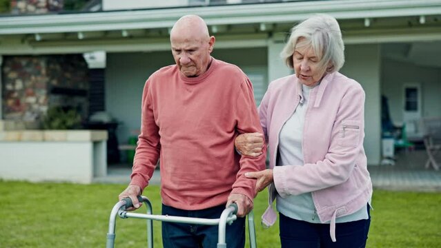 Walker, senior couple and walking outdoor with support and help with retirement and marriage. Wellness, guide and elderly woman and man together with love and care with mobility issue after surgery