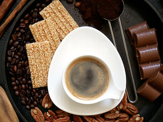Black espresso coffee, cookies, chocolate, pecans.