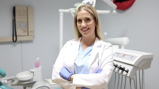 Portrait of a beautiful, young female dentist at her office