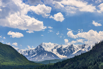 Altai mountains in snow under white clouds