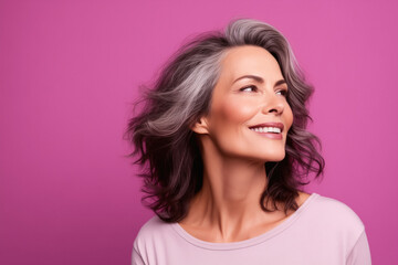Fototapeta premium Portrait of a woman isolated on a pink background