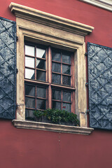 Window with shutters in retro style. Lviv streets. Architecture of Ukraine. European city. Facade of the house.