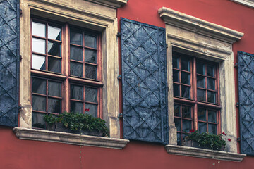 Window with shutters in retro style. Lviv streets. Architecture of Ukraine. European city. Facade of the house.