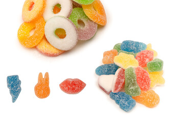 Assorted gummy candies isolated on a white background. Top view.