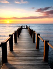 Obraz premium Wooden pier on the beach at beautiful sunset in the evening
