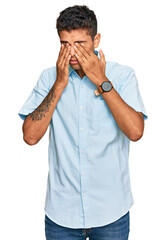 Young handsome african american man wearing casual clothes rubbing eyes for fatigue and headache,...