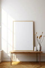 vertical empty white painting in a thin wooden frame leaning against a white wall
