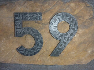 stone wall house number metal 59 fifty-nine