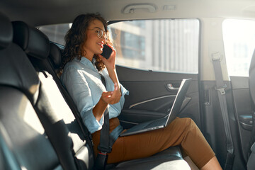 Businesswoman sitting in car