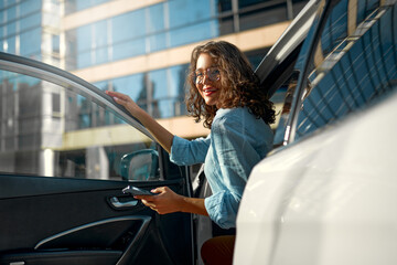 Woman near car on the street
