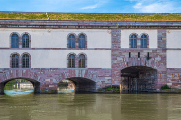 Fototapeta na wymiar Barrage Vauban, a bridge defensive erected in 1686-1690 in pink Vosges sandstone, Strasbourg, France