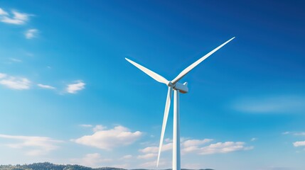A wind turbine against a blue sky, harnessing renewable energy.