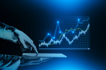 Close up of blue digital hand using smartphone with creative candlestick forex graph on grid. Dark...