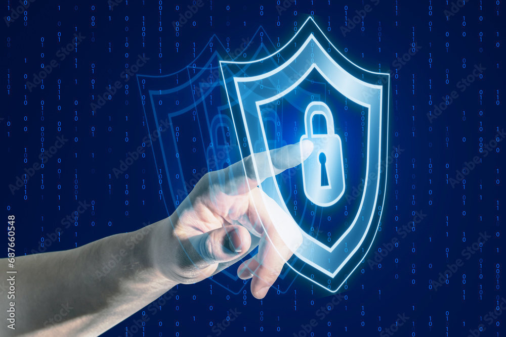 Poster close up of businessman hand pointing at creative digital security padlock and shield hologram on bl