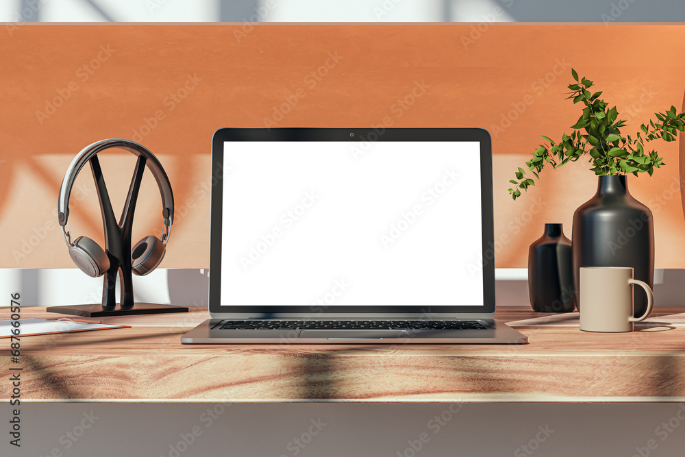 Poster close up of modern wooden designer desktop with empty white mock up place on laptop screen, coffee c