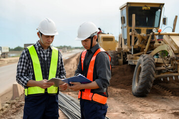 Highway engineers discuss plans for construction improvement based on roadworks. Soil Fill,...