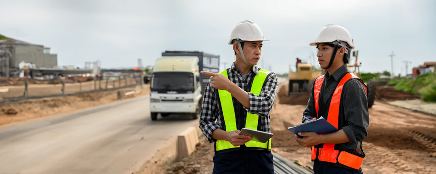Highway engineers discuss plans for construction improvement based on roadworks. Soil Fill, Backfill Compaction for Sub base, Base Course, Surveyor Engineer inspector in highway construction.