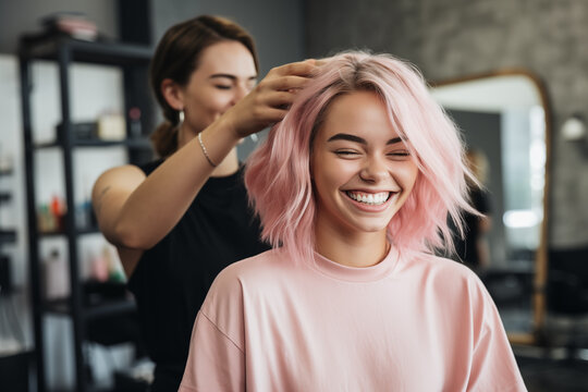 Satisfied And Happy Female Hairdresser Doing Haircut For A Young Pinkhaired Customer In Beauty Salon