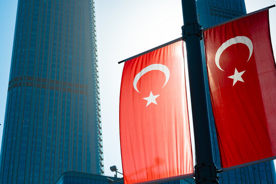 Turkish flags and skyscrapers on the background. Turkish Economy concept photo