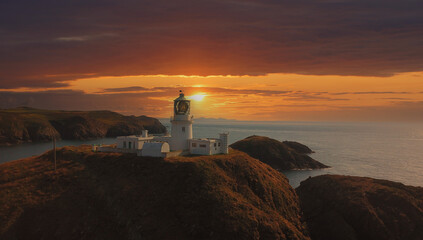 Lighthouse in the spectacular sunset on the English coast