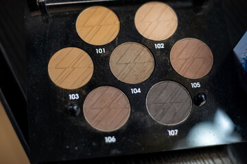 Coloristic solution. Palette of basic beige-brown shades for eye makeup, facial contours, top view. 