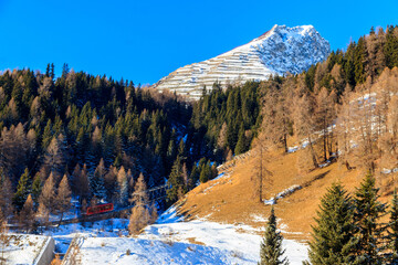 Red ski funicular in the Swiss Alps in winter resort Davos, Switzerland - obrazy, fototapety, plakaty