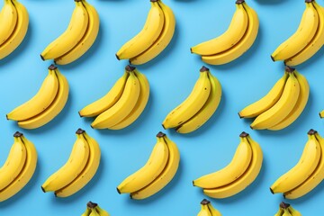 A bunch of bananas sitting on top of a blue surface. Suitable for food-related projects and healthy eating concepts