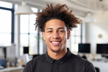 Man with curly hair standing in office. Perfect for business or professional concepts.