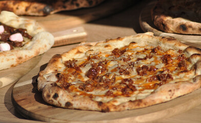 Cooked pizza ready to comming out of the oven, served meal